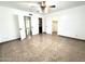 Bedroom featuring tiled flooring with views to the hallway, closet and bathroom at 10223 N 40Th Ave, Phoenix, AZ 85051
