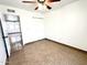 Bedroom with tiled flooring, with ceiling fan and view to the hallway and closet at 10223 N 40Th Ave, Phoenix, AZ 85051