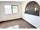 Well-lit bedroom featuring neutral walls, tiled floors and a decorative wall inset with sconces at 10223 N 40Th Ave, Phoenix, AZ 85051
