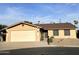 Lovely single-story home with a two-car garage and desert landscaping in the front yard at 10223 N 40Th Ave, Phoenix, AZ 85051