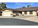 Charming single-story home with a two-car garage and low-maintenance desert landscaping in front at 10223 N 40Th Ave, Phoenix, AZ 85051
