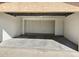 Empty two-car garage featuring white walls and concrete floor at 10223 N 40Th Ave, Phoenix, AZ 85051