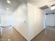 Bright hallway with tiled floors and recessed lighting, leading to various rooms at 10223 N 40Th Ave, Phoenix, AZ 85051