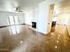 Bright living room featuring a fireplace, ceiling fan, and French doors leading to the backyard at 10223 N 40Th Ave, Phoenix, AZ 85051