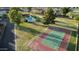 Aerial view showcasing a tennis court and pool within a lush, well-maintained community space at 10223 N 40Th Ave, Phoenix, AZ 85051