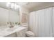 Bright bathroom with a vanity, neutral paint, decorative art, and tub-shower combo at 10828 N Biltmore Dr # 113, Phoenix, AZ 85029
