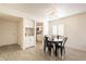 Charming dining area with a modern table, and easy access to both the kitchen and living area at 10828 N Biltmore Dr # 113, Phoenix, AZ 85029