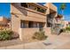 A view of the exterior of this multi-level townhome, complete with stairs to upper level units at 10828 N Biltmore Dr # 113, Phoenix, AZ 85029