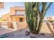 Exterior view of unit 114 with a desert-style garden featuring cactus and gravel at 10828 N Biltmore Dr # 113, Phoenix, AZ 85029