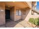 A welcoming view of the cozy front porch, stone landscaping and the front door to unit 113 at 10828 N Biltmore Dr # 113, Phoenix, AZ 85029