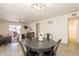 Open living space showcases a ceiling fan, lots of sunlight, and access to dining and kitchen at 10828 N Biltmore Dr # 113, Phoenix, AZ 85029
