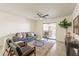 Comfortable living room with a cozy seating arrangement, and access to the outdoor patio at 10828 N Biltmore Dr # 113, Phoenix, AZ 85029