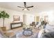 Open living room featuring modern decor, hard surface floors, leading to dining and kitchen at 10828 N Biltmore Dr # 113, Phoenix, AZ 85029