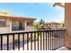 This balcony offers a community view of well maintained landscaping and similar architectural design in a residential neighborhood at 1225 N 36Th St # 2081, Phoenix, AZ 85008