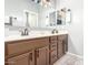 Bathroom vanity features double sinks, ample storage, and modern fixtures and lighting at 1225 N 36Th St # 2081, Phoenix, AZ 85008