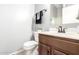 Bathroom features a tiled floor, toilet and a sink at 1225 N 36Th St # 2081, Phoenix, AZ 85008