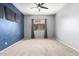 Spacious bedroom features plush carpet, ceiling fan and a large window for natural light at 1225 N 36Th St # 2081, Phoenix, AZ 85008