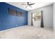 Spacious bedroom with large window and accent wall at 1225 N 36Th St # 2081, Phoenix, AZ 85008
