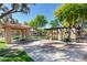 Inviting picnic area with shaded pergola, barbecue grills, and well-maintained landscaping for community gatherings at 1225 N 36Th St # 2081, Phoenix, AZ 85008