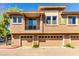 A well-maintained two-story townhome featuring private garages and a balcony at 1225 N 36Th St # 2081, Phoenix, AZ 85008