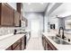 Gourmet kitchen with tiled backsplash, stainless appliances, and breakfast bar at 1225 N 36Th St # 2081, Phoenix, AZ 85008