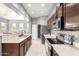 Modern kitchen features breakfast bar, stainless appliances, tile backsplash and pantry at 1225 N 36Th St # 2081, Phoenix, AZ 85008