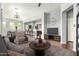 Open-concept living room with modern furnishings, flowing seamlessly into the kitchen and dining area at 1225 N 36Th St # 2081, Phoenix, AZ 85008
