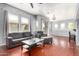 Bright living room featuring hardwood floors, a ceiling fan, and modern decor at 1225 N 36Th St # 2081, Phoenix, AZ 85008