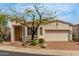 Charming single-story home with a desert-landscaped front yard and brick-paved driveway leading to an attached two-car garage at 12841 N 19Th St, Phoenix, AZ 85022