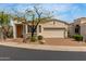 Charming single-story home with a desert-landscaped front yard and brick-paved driveway leading to an attached two-car garage at 12841 N 19Th St, Phoenix, AZ 85022