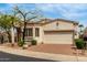 Inviting single-story home with a desert-landscaped yard and brick driveway to the attached garage, offering a welcoming curb appeal at 12841 N 19Th St, Phoenix, AZ 85022