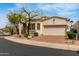 Inviting single-story home with a desert-landscaped yard and brick driveway to the attached garage, offering a welcoming curb appeal at 12841 N 19Th St, Phoenix, AZ 85022