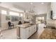 Open kitchen with granite island, stainless appliances, and backyard views at 12841 N 19Th St, Phoenix, AZ 85022