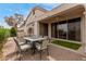 Charming patio with brick pavers, outdoor seating, and sliding glass doors to the home at 12841 N 19Th St, Phoenix, AZ 85022