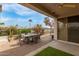 Inviting covered patio with dining furniture and a view of the desert landscape at 12841 N 19Th St, Phoenix, AZ 85022