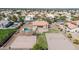 Aerial view features a beautiful backyard with a pool, sports court, and lush landscaping at 1289 E Palo Blanco Way, Gilbert, AZ 85296