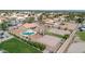 Beautiful aerial view of a spacious property with a pool, volleyball court, basketball court, lush landscaping and a private backyard at 1289 E Palo Blanco Way, Gilbert, AZ 85296