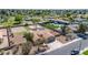 Desirable aerial view of a home with a beautiful pool, large sports court and sand volleyball court at 1289 E Palo Blanco Way, Gilbert, AZ 85296