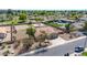 Aerial view showcases a home with an outdoor sports court, sand volleyball court, and private pool at 1289 E Palo Blanco Way, Gilbert, AZ 85296