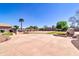 Expansive backyard features a volleyball court, built-in grill, mature trees, and lush landscaping at 1289 E Palo Blanco Way, Gilbert, AZ 85296