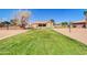 Spacious backyard including sport court, grass area, and outdoor entertainment at 1289 E Palo Blanco Way, Gilbert, AZ 85296