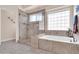 Relaxing bathroom with a separate glass shower and soaking tub at 1289 E Palo Blanco Way, Gilbert, AZ 85296