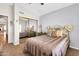 Comfortable bedroom featuring neutral decor, a large closet, and a ceiling fan at 1289 E Palo Blanco Way, Gilbert, AZ 85296