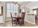 Charming dining area featuring a wood table set and large window with plantation shutters at 1289 E Palo Blanco Way, Gilbert, AZ 85296