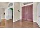 Welcoming foyer featuring hardwood floors and a glimpse into various rooms of the home at 1289 E Palo Blanco Way, Gilbert, AZ 85296