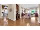 Elegant foyer with hardwood floors transitioning into a dining area with a chandelier at 1289 E Palo Blanco Way, Gilbert, AZ 85296