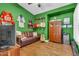 Eclectic living room showcasing a leather sofa, guitars, and hockey memorabilia at 1289 E Palo Blanco Way, Gilbert, AZ 85296