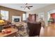 Bright living room featuring a fireplace, hardwood floors, and comfortable seating arrangements at 1289 E Palo Blanco Way, Gilbert, AZ 85296