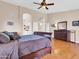 Spacious main bedroom with hardwood floors, ceiling fan, and ensuite bathroom access at 1289 E Palo Blanco Way, Gilbert, AZ 85296