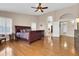 Large main bedroom boasting hardwood floors, ceiling fan, and access to the ensuite bathroom at 1289 E Palo Blanco Way, Gilbert, AZ 85296